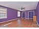 Spacious bedroom with wood flooring, ceiling fan and purple walls at 936 23Rd Ne Ave, Hickory, NC 28601