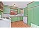 Retro kitchen with green cabinets and white appliances at 936 23Rd Ne Ave, Hickory, NC 28601