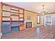 Living room with built-in shelving, fireplace, and hardwood floors at 936 23Rd Ne Ave, Hickory, NC 28601