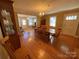 Spacious dining room with hardwood floors and views of living room at 9915 Washam Potts Rd, Cornelius, NC 28031