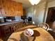 Kitchen boasts wood cabinets, a white refrigerator, and a breakfast bar at 9915 Washam Potts Rd, Cornelius, NC 28031