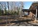 Backyard with a chain link fence and screened porch at 109 Shamrock Dr, Chester, SC 29706