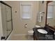 Clean bathroom with a shower/tub combo and granite vanity at 109 Shamrock Dr, Chester, SC 29706