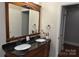 Double vanity bathroom with granite countertop and large mirror at 109 Shamrock Dr, Chester, SC 29706
