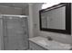 Bathroom with shower and white vanity with speckled countertop at 109 Shamrock Dr, Chester, SC 29706