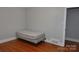 Small bedroom with hardwood floors and a window at 109 Shamrock Dr, Chester, SC 29706