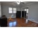 Bedroom with hardwood floors and mirrored closet doors at 109 Shamrock Dr, Chester, SC 29706