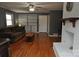 Living room with hardwood floors, white fireplace and built-in shelving at 109 Shamrock Dr, Chester, SC 29706