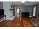 Living room with hardwood floors and a white brick fireplace at 109 Shamrock Dr, Chester, SC 29706