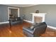 Living room features hardwood floors, fireplace and view into dining area at 109 Shamrock Dr, Chester, SC 29706