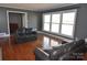 Spacious living room with hardwood floors, fireplace and large windows at 109 Shamrock Dr, Chester, SC 29706