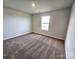 Spacious bedroom with carpet flooring and a window at 114 Lightning Dr, Shelby, NC 28152