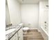 Bathroom with granite countertop, white cabinets, and bathtub at 118 Lightning Dr, Shelby, NC 28152