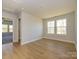 Bright bedroom features two windows, a walk-in closet and wood-look floors at 119 Quartz Hill Way, Waxhaw, NC 28173
