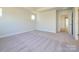 Large bedroom with neutral carpet, walk in closet and ensuite bathroom at 119 Quartz Hill Way, Waxhaw, NC 28173