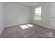 Bedroom featuring carpet, a window and natural light at 119 Quartz Hill Way, Waxhaw, NC 28173