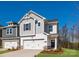 Charming two-story home with a two-car garage and well-manicured lawn against a vibrant blue sky at 119 Quartz Hill Way, Waxhaw, NC 28173