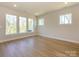 This spacious living room with lots of windows offers great natural light at 119 Quartz Hill Way, Waxhaw, NC 28173