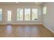 Bright living room with wood floors and views of the yard at 119 Quartz Hill Way, Waxhaw, NC 28173