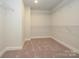 Spacious walk-in closet featuring carpeted flooring and white wire shelving at 119 Quartz Hill Way, Waxhaw, NC 28173