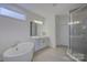 Elegant bathroom with a free-standing bathtub and walk-in shower at 1224 Regions Blvd, Fort Mill, SC 29707