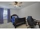 Cozy bedroom with twin bed, desk and blue curtains at 1224 Regions Blvd, Fort Mill, SC 29707