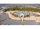 Aerial view of community clubhouse with parking, playground, and walking trails, offering recreational amenities at 1224 Regions Blvd, Fort Mill, SC 29707