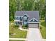 Charming two-story home with a well-maintained lawn and a two-car garage in a desirable neighborhood at 1224 Regions Blvd, Fort Mill, SC 29707