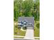 Beautiful two-story home with a well-manicured lawn, inviting front porch, and a two-car garage at 1224 Regions Blvd, Fort Mill, SC 29707