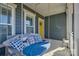 Inviting front porch featuring a swing with decorative pillows and a bright yellow door at 1224 Regions Blvd, Fort Mill, SC 29707
