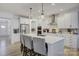 Spacious kitchen island with seating, white cabinets, and stainless steel appliances at 1224 Regions Blvd, Fort Mill, SC 29707
