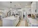 White kitchen with large island, stainless steel appliances, and ample counter space at 1224 Regions Blvd, Fort Mill, SC 29707