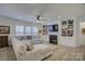 Spacious living room with a sectional sofa, fireplace, and built-in shelving at 1224 Regions Blvd, Fort Mill, SC 29707
