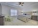 Bright main bedroom with a king-size bed and en-suite bathroom at 1224 Regions Blvd, Fort Mill, SC 29707