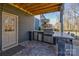 Outdoor kitchen featuring a built-in grill, counter space, and stone accents, perfect for entertaining at 1224 Regions Blvd, Fort Mill, SC 29707