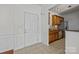 Kitchen and entryway with wood cabinets and tile floor at 14712 Via Sorrento Dr, Charlotte, NC 28277