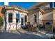 Covered outdoor area with seating next to the house's stone accents at 15618 Frohock Pl, Charlotte, NC 28277