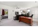 Bright living room with ceiling fan and modern furniture adjacent to bedroom at 15618 Frohock Pl, Charlotte, NC 28277