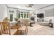 Cozy living room features an ornate fireplace, modern lighting, and elegant decor at 15618 Frohock Pl, Charlotte, NC 28277