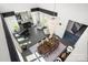 Aerial view of the open floorplan living space with a dining table, piano, and comfortable seating area at 15618 Frohock Pl, Charlotte, NC 28277