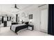 Serene bedroom with contemporary decor, ceiling fan, and large windows at 15618 Frohock Pl, Charlotte, NC 28277