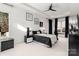 Inviting bedroom with a ceiling fan, abundant natural light, and stylish furnishings at 15618 Frohock Pl, Charlotte, NC 28277