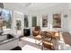Sunroom with multiple large windows, an eating area, and view to yard at 15618 Frohock Pl, Charlotte, NC 28277