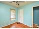 Small bedroom with light blue walls and wood floors at 1726 Umstead St, Charlotte, NC 28205