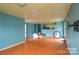 Living room with hardwood floors and a view of the kitchen at 1726 Umstead St, Charlotte, NC 28205