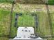 A bird's eye view of a backyard featuring garden beds, seating area, and lush green grass at 18022 Stark Way, Charlotte, NC 28278