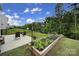 Well-kept backyard featuring a patio, perfect for outdoor dining, and raised garden beds at 18022 Stark Way, Charlotte, NC 28278