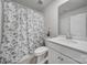 This bathroom has a shower, a vanity and a sink with a neutral color pallete at 18022 Stark Way, Charlotte, NC 28278