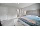Spacious bedroom featuring soft, neutral colors, plush carpeting, and a cozy sitting area at 18022 Stark Way, Charlotte, NC 28278
