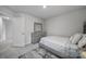 Cozy bedroom features neutral walls, soft carpet, and minimalist decor, creating a relaxing atmosphere at 18022 Stark Way, Charlotte, NC 28278